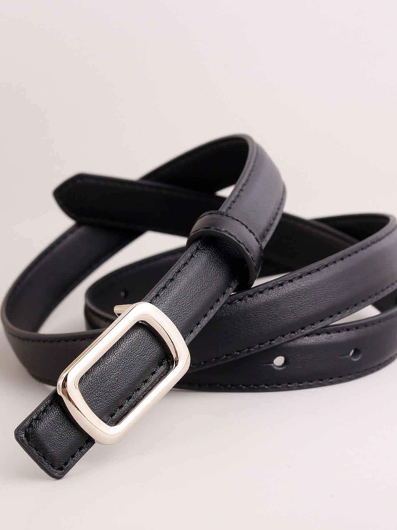 Black leather skinny belt with silver rectangular buckle