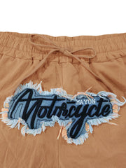 Khaki sweatpants with drawstring and distressed motorcycle graphic patch