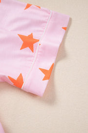 Blush pink pajama top with orange stars and white piping detail.