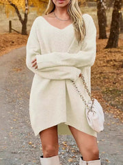 Cream oversized ribbed knit mini dress with V-neck and long sleeves.