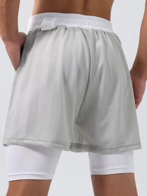Gray layered mesh performance shorts with white compression liner and striped texture.