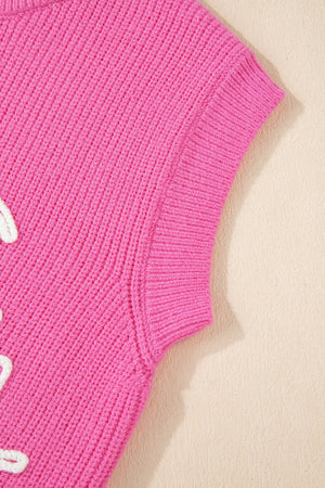 Fuchsia pink ribbed knit vest with embroidered white equine detail.