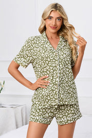 Moss green leopard print pajama set with white piping, short sleeves and shorts.