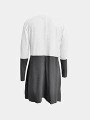 Colorblock tunic dress in gray and white with long sleeves.