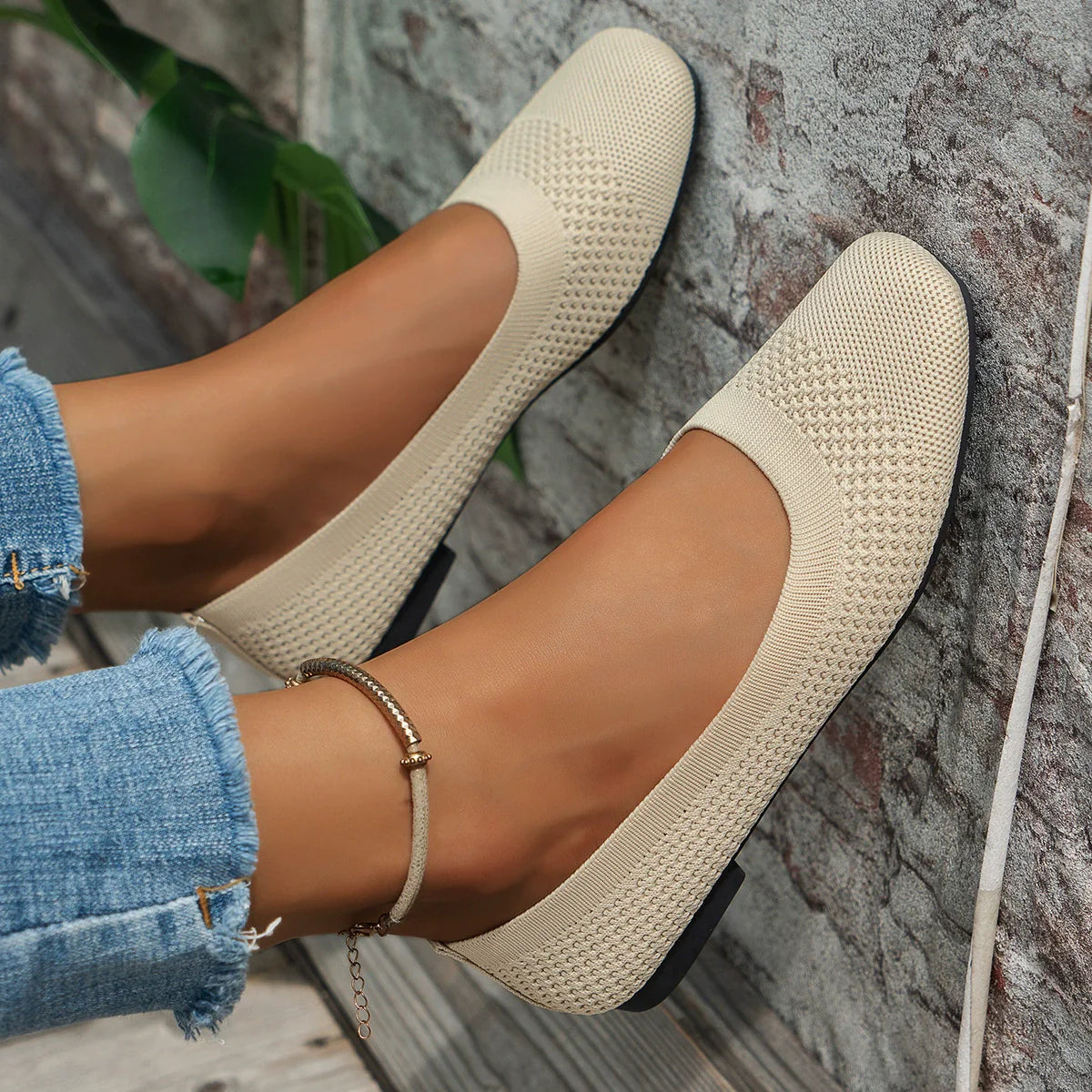 Beige breathable knit square-toe flats with a low heel.