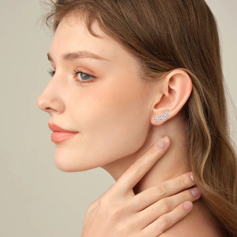 Silver leaf climber earrings with crystals, designed to ascend the earlobe.