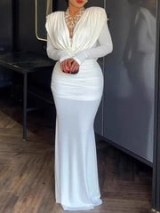 White ruched long-sleeve maxi dress with cowl neck and draped bodice.