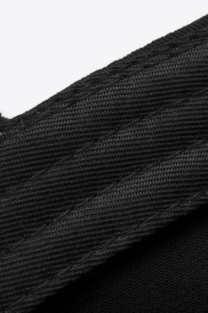 Black baseball cap with textured fabric and stitched details