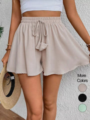 Off white cotton chino shorts with drawstring waist and a-line cut.