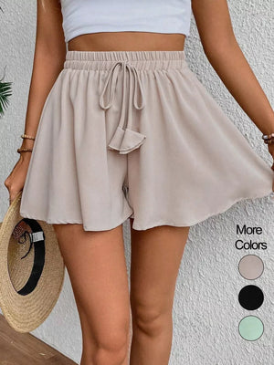 Off white cotton chino shorts with drawstring waist and a-line cut.