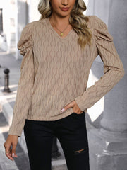 Mocha knit sweater with wave stitch pattern, V-neck, and puff sleeves.