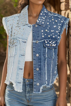 Two-tone denim vest with pearl and stud embellishments, frayed hem, and distressed details.