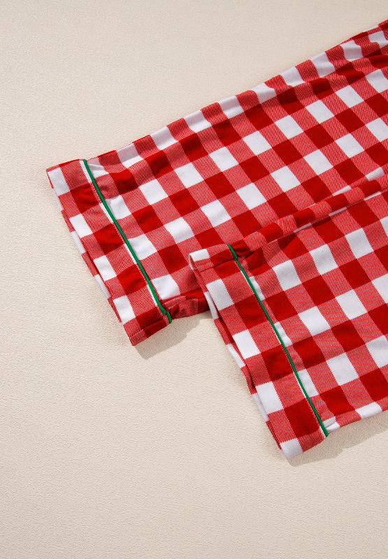Festive red and white gingham pajama set with green trim detail.