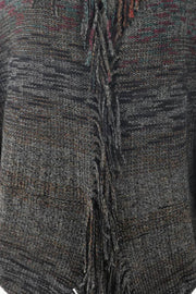 Textured knit cape in gray with colorful threads and fringe detail