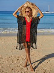 Black crochet cover-up with red contrast trim and fringe hem, V-neck, short sleeves.