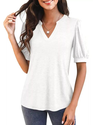 White puff sleeve t-shirt with notched V-neck and cuffed short sleeves.