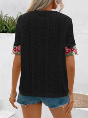 Black eyelet peasant blouse with embroidered floral sleeves and V-neck