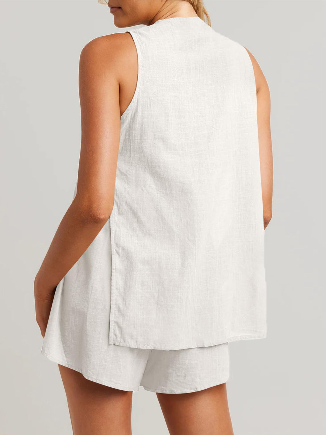 White linen co-ord set with sleeveless top and shorts, showing back detail.