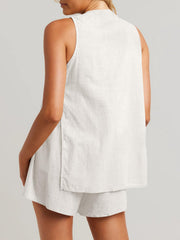 White linen co-ord set with sleeveless top and shorts, showing back detail.