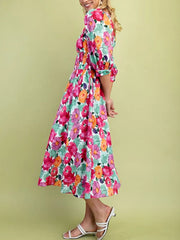 Floral V-neck zip midi dress with smocked waist and puff sleeves in a cotton blend.