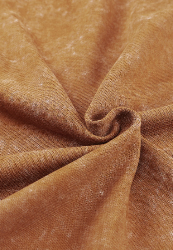 Washed cotton utility jacket in caramel with a tie-dye effect.