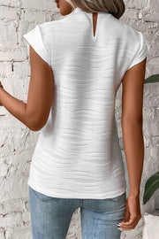 White textured wave cap-sleeve mock neck top with keyhole back detail
