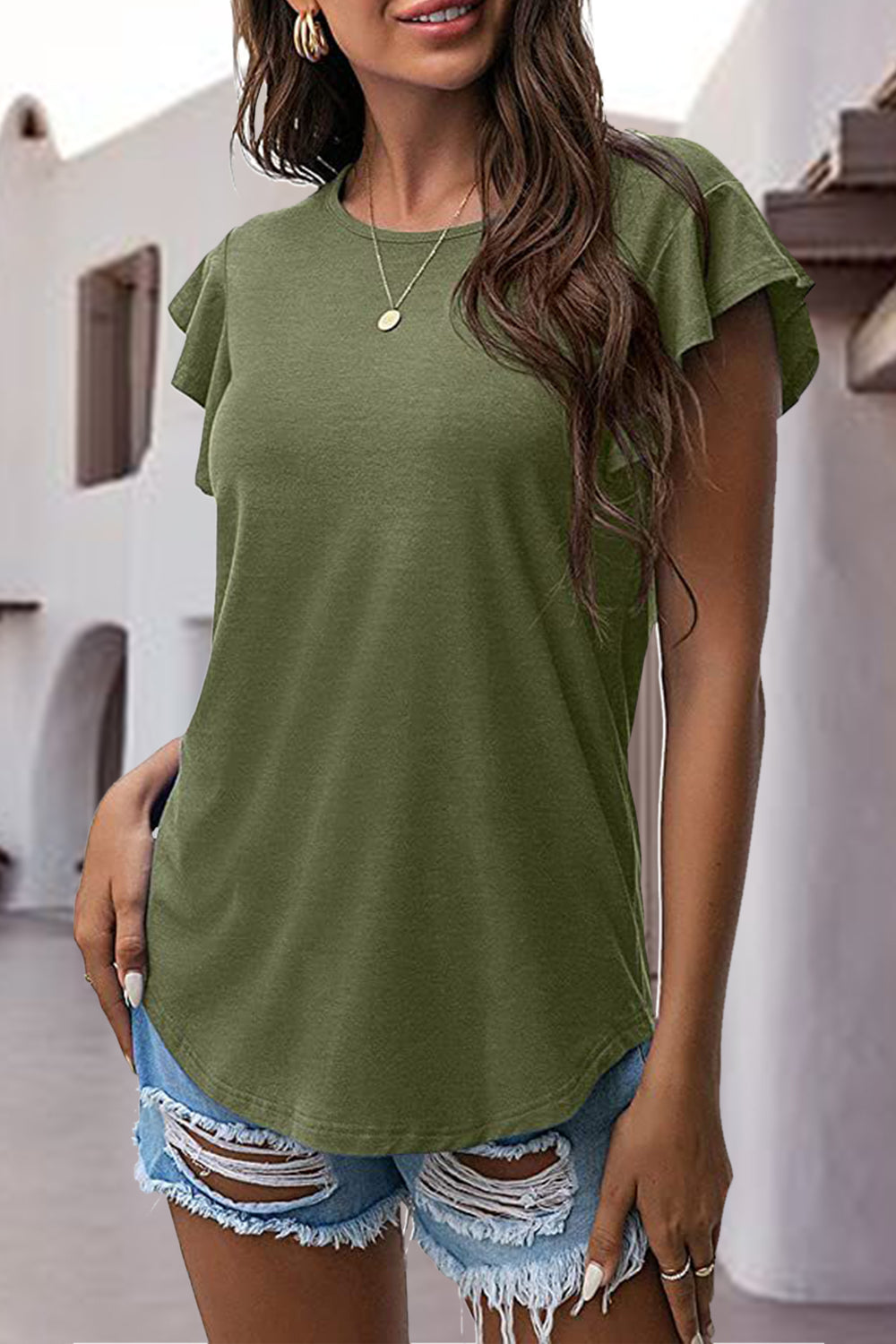 Matcha green t-shirt with ruffled short sleeves and a crew neck, styled with ripped denim shorts.