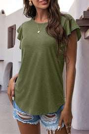 Matcha green t-shirt with ruffled short sleeves and a crew neck, styled with ripped denim shorts.
