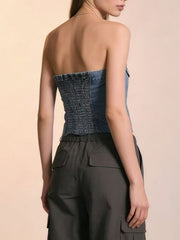 Blue denim cropped strapless top with smocked back and button detail.