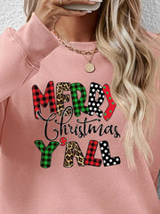 Blush pink crewneck sweatshirt with festive mixed print Merry Christmas Yall graphic.