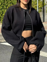 Black zip up cropped bomber jacket with balloon sleeves and silver zipper detail.