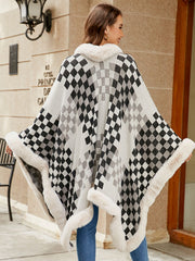 Checkered cape with faux fur trim in black and white, acrylic, open front, cozy winter outerwear.