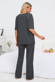 Dark gray loungewear set with a short sleeve tee and wide leg pants.