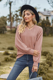 Textured cable knit V-neck sweater in Dusty Pink with long sleeves.