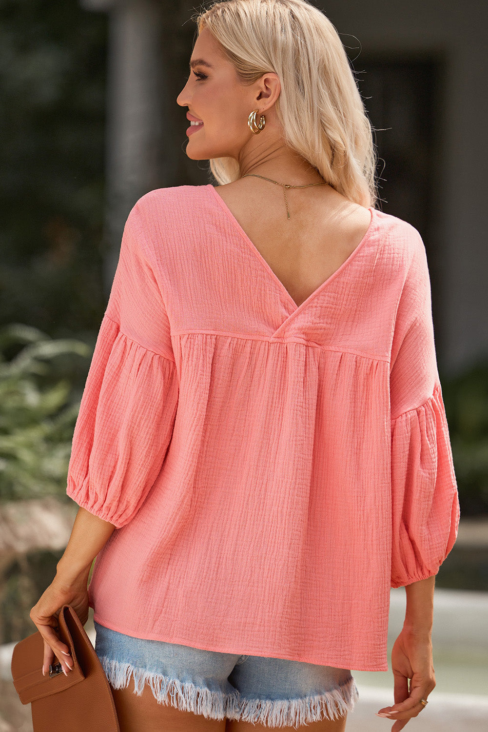 Textured gauze blouse in Burnt Coral with gathered sleeves and V-neck