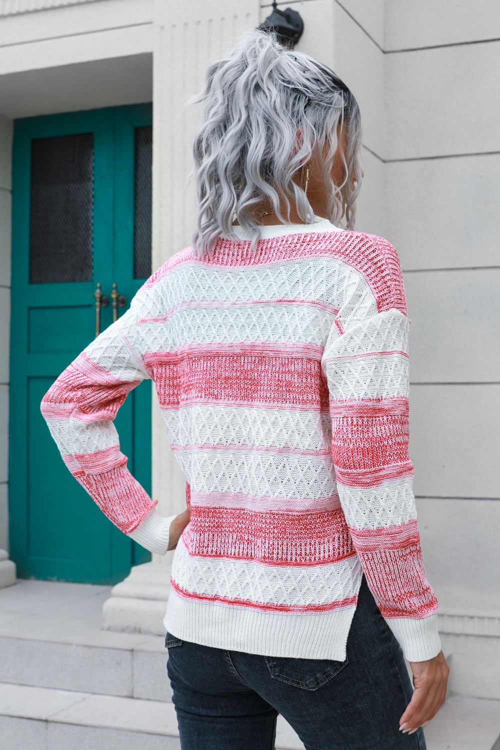 Ombre stripe knit sweater in pink and white acrylic with a crew neck and long sleeves.
