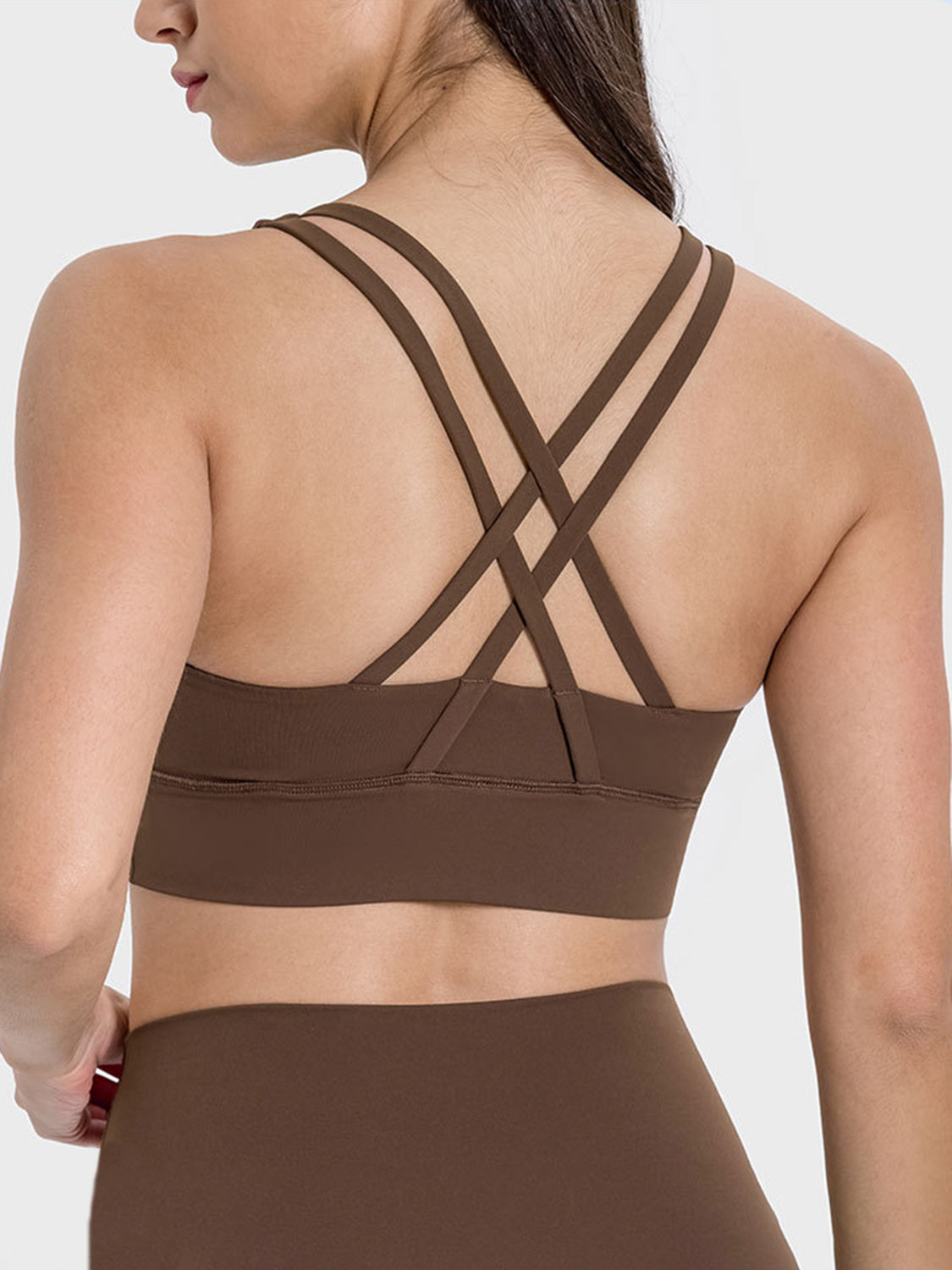 Crisscross back sports bra in caramel with strappy detail.