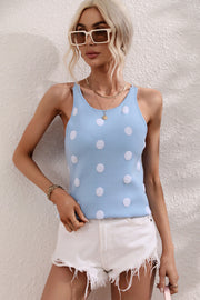 Pastel blue polka dot knit tank top with a round neckline and textured dots.