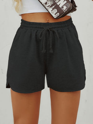 Black textured drawstring lounge shorts with slit hems