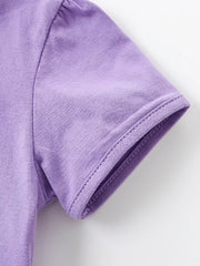 Lavender cotton baby dress sleeve detail with puffed shoulder and double-stitched hem.