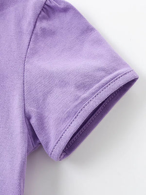Lavender cotton baby dress sleeve detail with puffed shoulder and double-stitched hem.