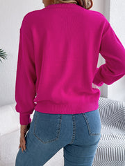 Hot pink acrylic cable knit sweater with contrast detail, crew neck, long sleeves.