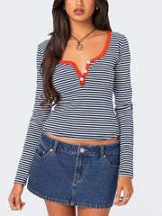 Striped Henley with contrast collar and buttons, navy and white stripes, long sleeves.