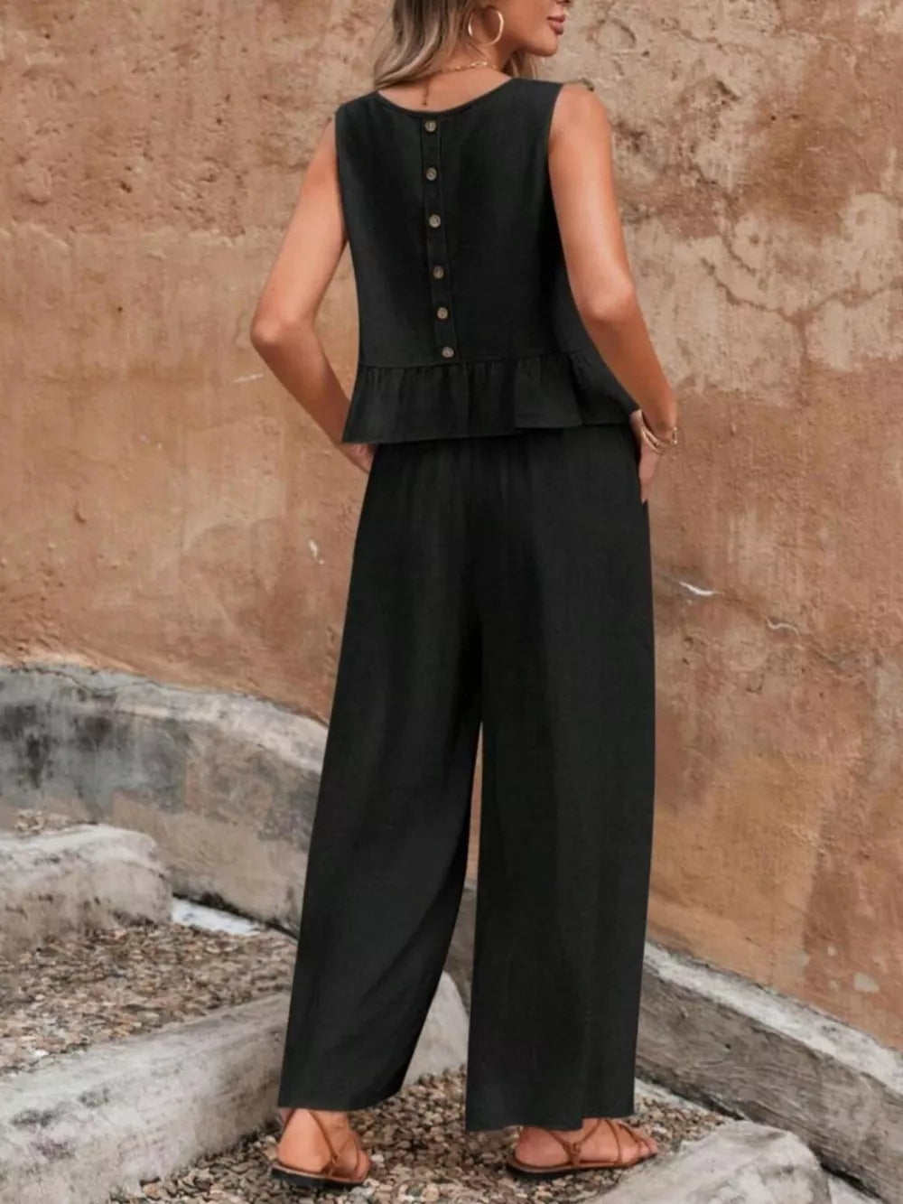 Black ruffled peplum top with button back and wide-leg pants set