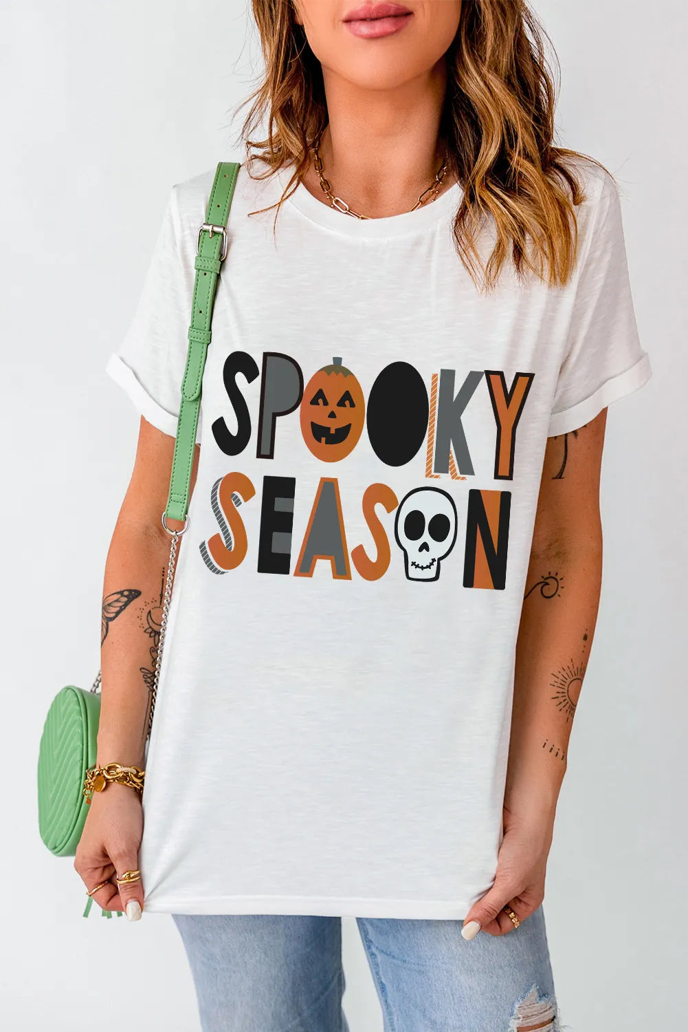 White Vibe Letter Print T-Shirt with "Spooky Season" graphic featuring a pumpkin and skull.