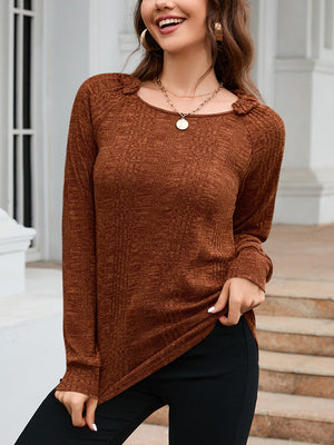Chestnut textured knit top with raglan sleeves and a scoop neckline.