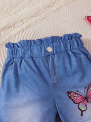 Baby denim shorts with elastic ruffled waist, button detail, and pink butterfly graphic.