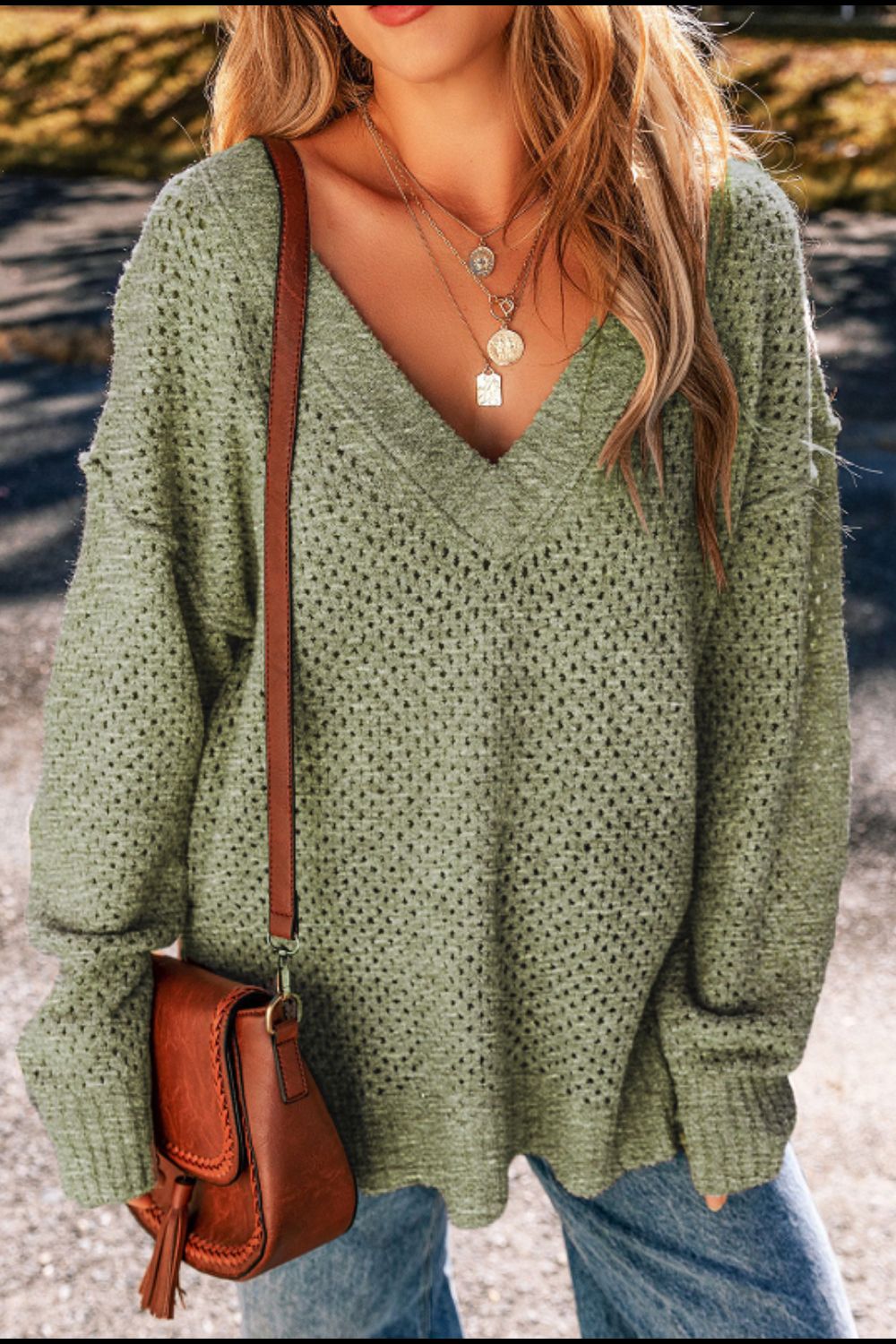 Open-knit slouchy V-neck sweater in matcha green with a relaxed fit.