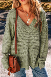 Open-knit slouchy V-neck sweater in matcha green with a relaxed fit.