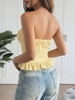 Yellow ruffled hem strapless tube top with a cinched bodice and peplum detail.